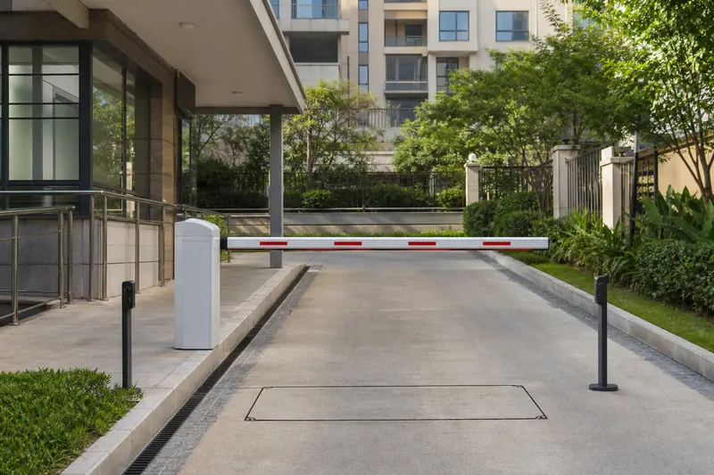 Residential boom barrier with loop and opposing safety photocells.