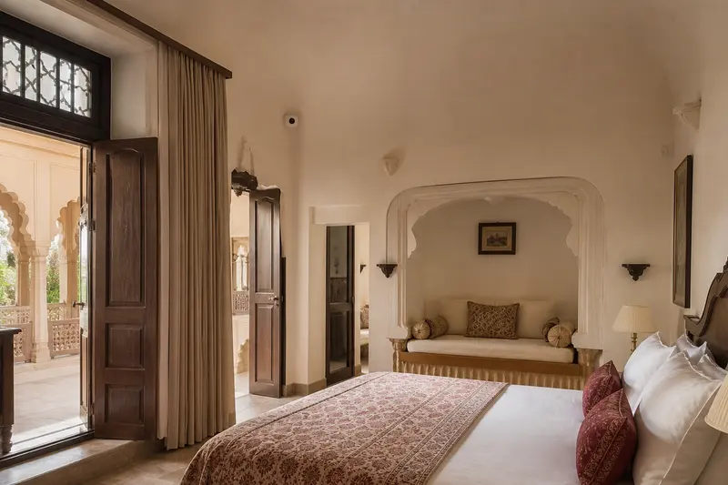 Heritage Rajasthan guest room with restrained sensor and concealed curtain automation.