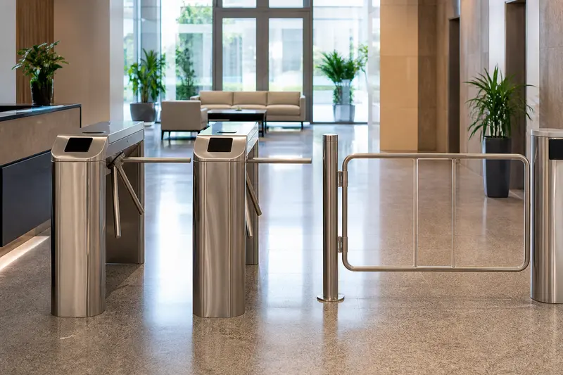 Tripod office lanes beside a separate accessible swing gate.