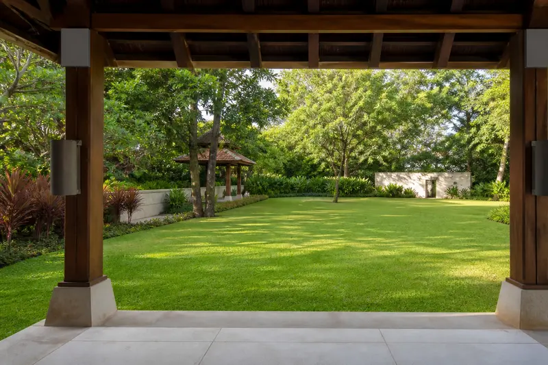 Pavilion-column audio covering an open yoga lawn.