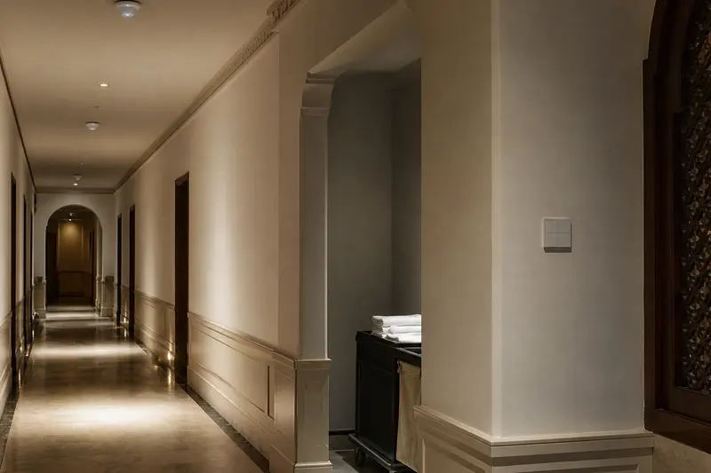 Hotel corridor combines presence sensing, zoned lighting and a blank KNX keypad.