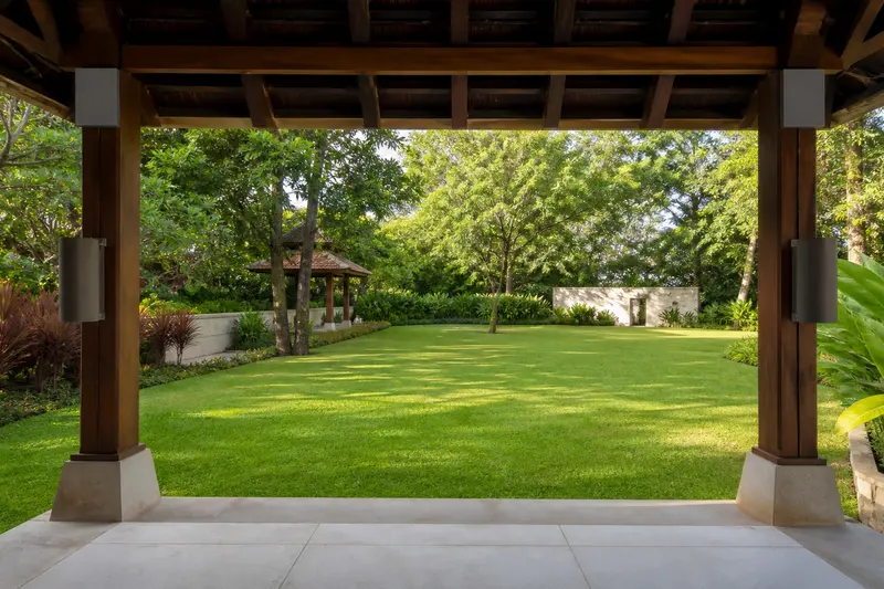 Pavilion-column audio covering an open yoga lawn.