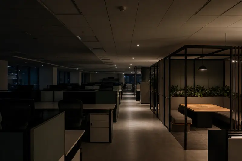 After-hours office demonstrates occupancy-based lighting zones and safe circulation lighting.