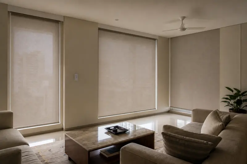 Concept illustration of the same living room with all three roller shades lowered